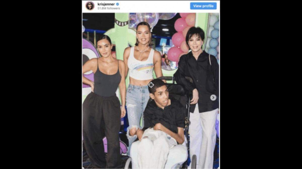 Khloe Kardashian with Amari, her sister Kim Kardashian and her mom Kris Jenner.