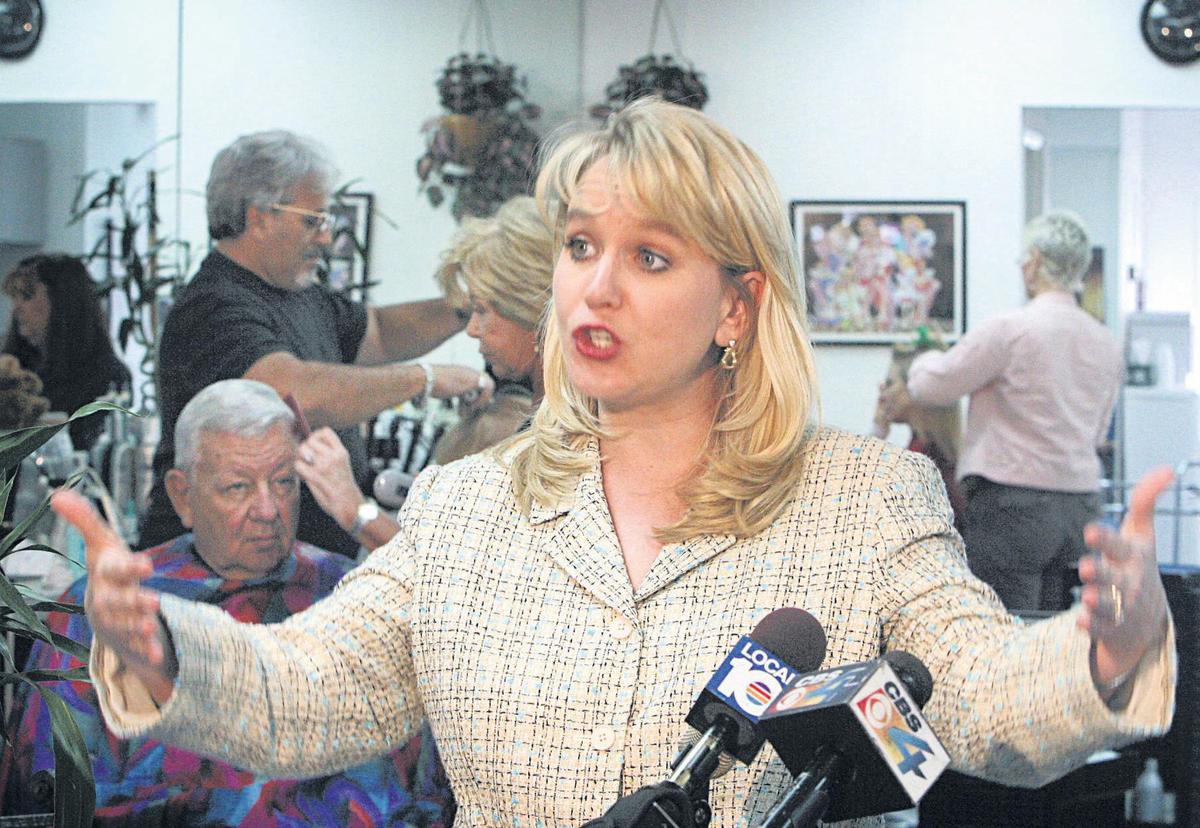 Tiffany Carr – shown during a 2004 visit to a Hollywood nail salon, where she spoke on domestic violence – was the longtime CEO of the Florida Coalition Against Domestic Violence.