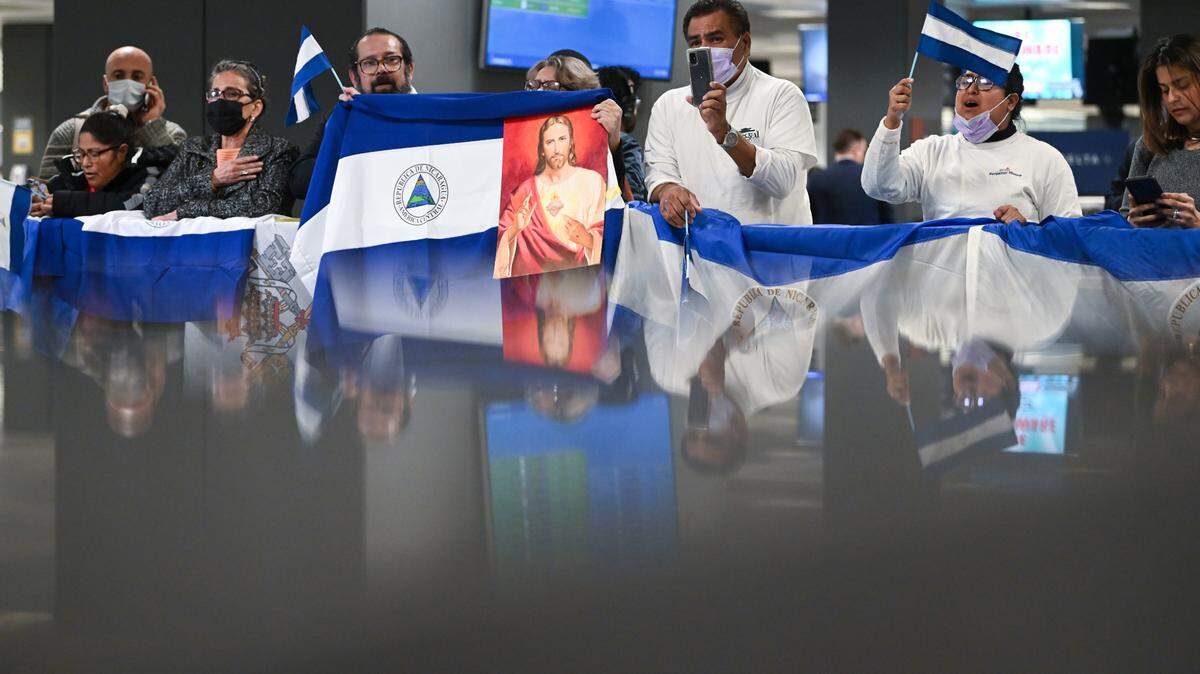 People gather at Dulles International Airport two years ago to welcome political prisoners who were released from Nicaragua on Thursday and flown to the United States.