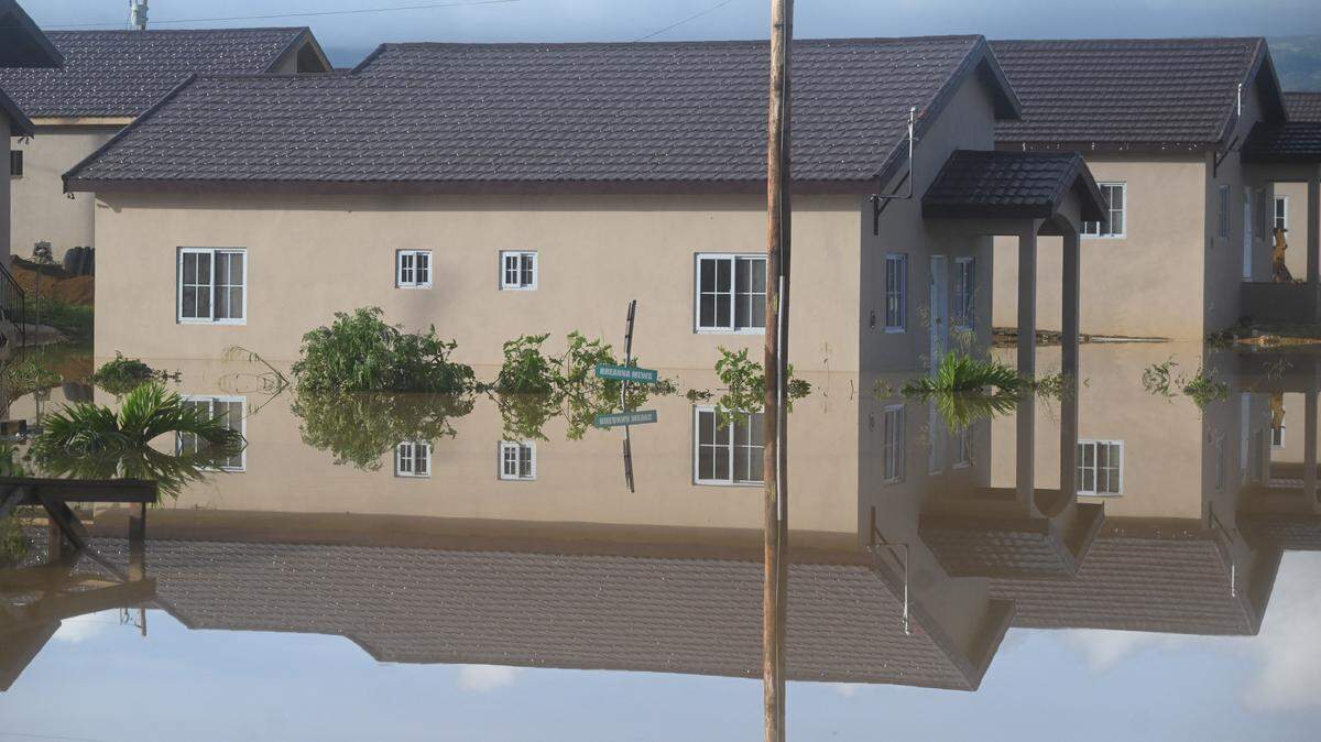 Flooded homes are seen after the passage of Hurricane Melissa in Howard Acres neighborhood in St. Elizabeth, Jamaica on October 29, 2025. Hurricane Melissa ripped up trees and knocked out power after making landfall in Jamaica on October 28, 2025 as one of the most powerful hurricanes on record, inundating the island nation with rains that threaten flash floods and landslides.