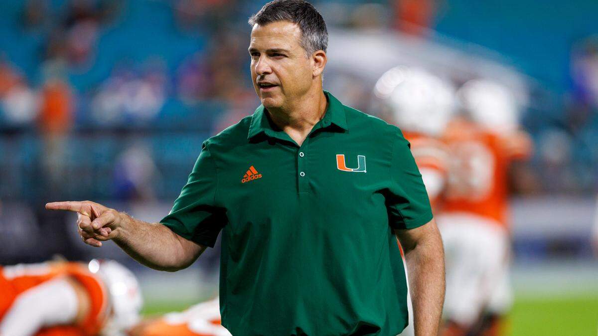 Miami Hurricanes head coach Mario Cristobal give instructions to his team during pregame warmups before the start of an ACC conference football game against the Pittsburgh Panthers at Hard Rock Stadium on Saturday, November 26, 2022 in Miami Gardens, Florida.