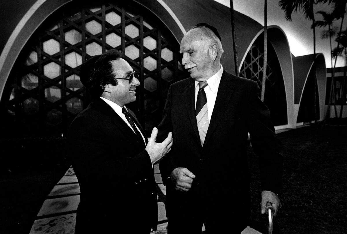 Rabbi Gary Glickstein and Rabbi Leon Kronish, the founding rabbi of Temple Beth Sholom in the 1940s, gather at the synagogue in 1985.