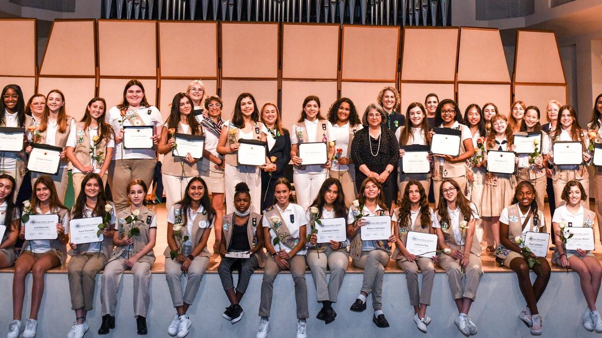 Former Girl Scout and Miami-Dade County Mayor Daniella Levine Cava, in black dress, with some of the Girl Scout Gold and Silver award honorees and Girl Scout of Tropical Florida staff and board members at FIU’s Wertheim Performing Arts Center on June 5.  