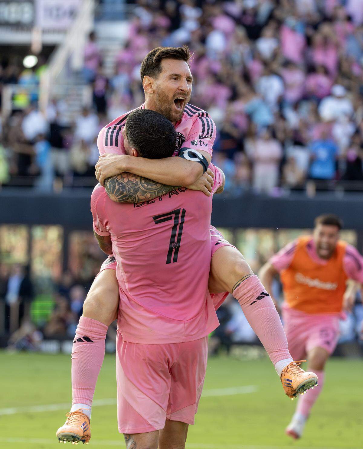 Inter Miami midfielder Rodrigo De Paul (7) celebrates with forward Lionel Messi (10) after scoring the go-ahead goal during the second half of the MLS Cup final against the Vancouver Whitecaps at Chase Stadium on Saturday, Dec. 6, 2025, in Fort Lauderdale, Fla.