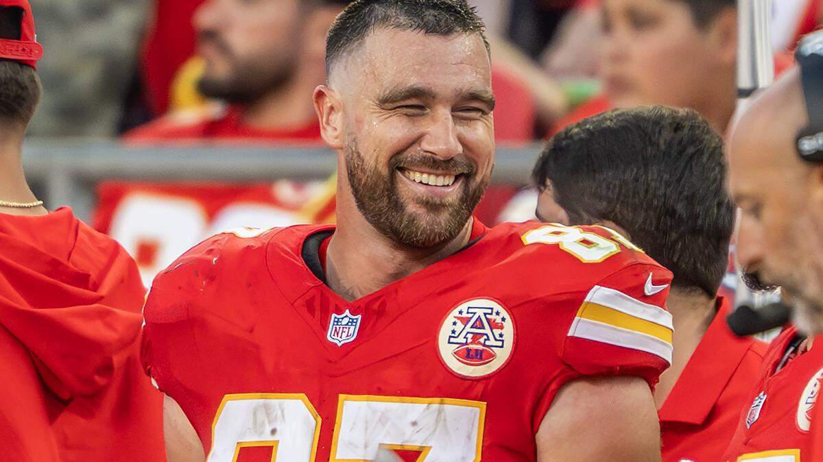 Kansas City Chiefs tight end Travis Kelce (87) smiles while standing on the sideline in the fourth quarter during an NFL game against the Baltimore Ravens on Sunday, Sept. 28, 2025, at GEHA Field at Arrowhead Stadium.