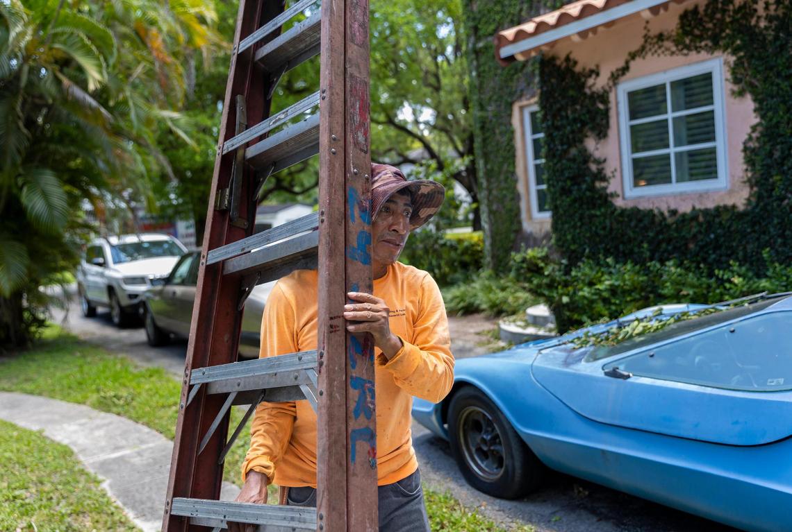 Landscaper Ciro Perez, 49, is seen working at a home on Thursday, May 11, 2023, in Coral Gables, Fla.