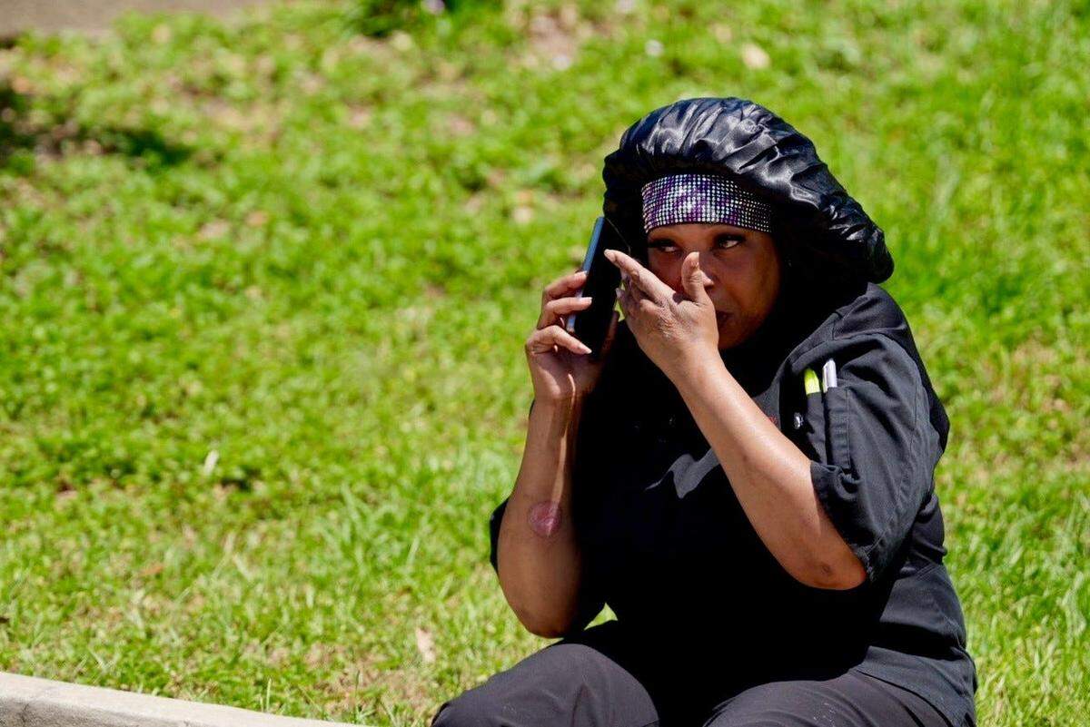 A woman talking on her phone after being evacuated on FSU campus after a mass shooting occurred Thursday.