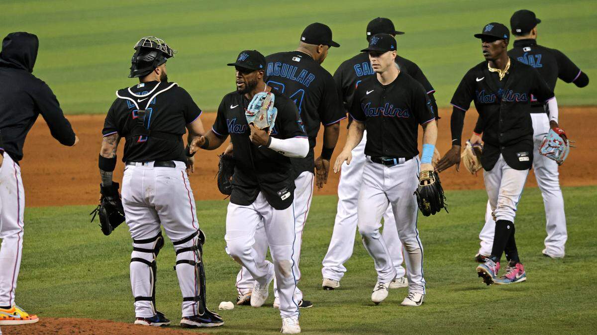 Miami Marlins players celebrate their 4-3 win over the Atlanta Braves during their baseball game at loanDepot park on Friday, June 11, 2021 in Miami, Florida.