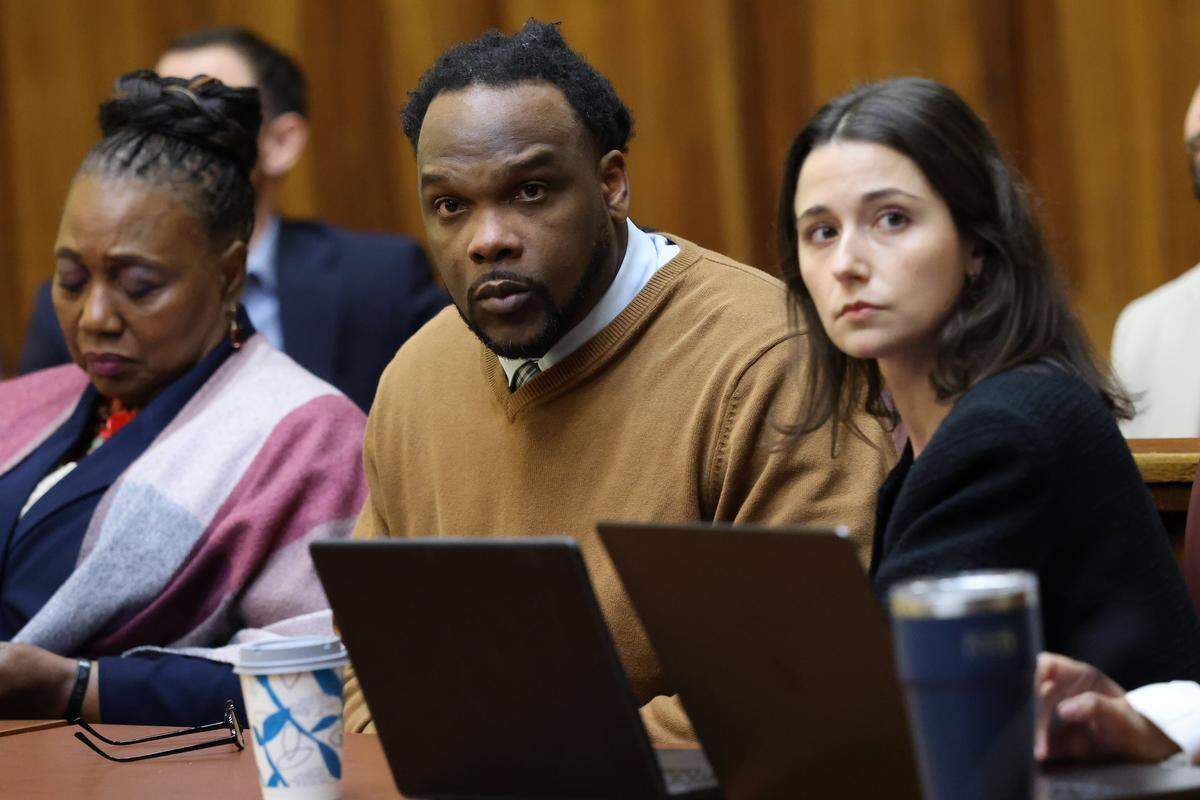 Rashaun Jones, who is accused of killing his University of Miami football teammate Bryan Pata in 2006, sits with defense attorneys in Judge Cristina Miranda Courtroom 4-1 at the Richard E. Gerstein Justice Building in Miami, FL, on Monday, March 2, 2026.