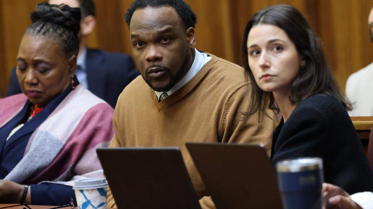 Rashaun Jones, who is accused of killing his University of Miami football teammate Bryan Pata in 2006, sits with defense attorneys in Judge Cristina Miranda Courtroom 4-1 at the Richard E. Gerstein Justice Building in Miami, FL, on Monday, March 2, 2026.