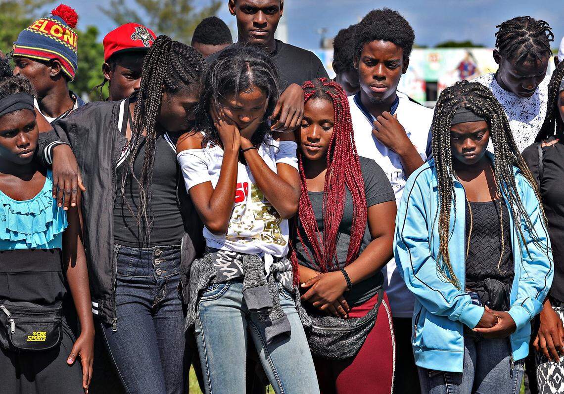 Little Haiti FC Soccer Club teammates gather to grieve and console one another as the team held a press conference about the loss of three fellow players at its home field on Monday, May 27, 2019, in Miami’s Little Haiti’s neighborhood.