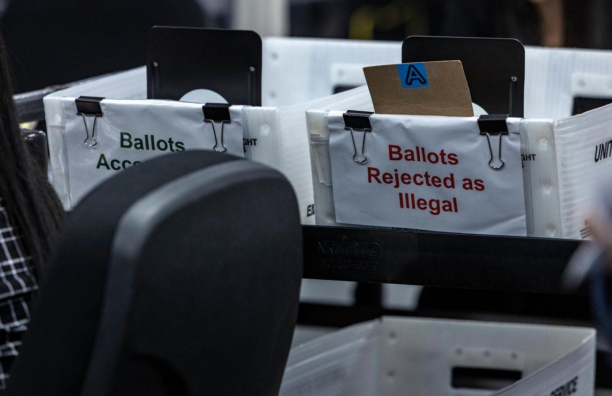 Baskets for rejected ballots on the right and accepted ballots on the left at the Miami-Dade County Elections Department in Doral where the Canvassing Board met on Oct. 20, 2022.