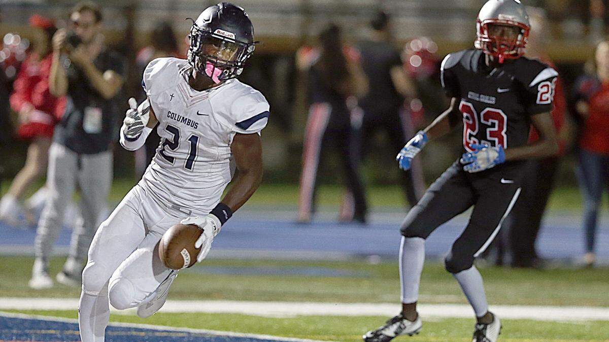 Explorers’ (RB) Henry Parrish jr. #21, scores a touchdown during the second quarter of the Coral Gables Cavaliers vs Columbus Explorers high school football game at Tropical Park on Friday, October 27, 2017.