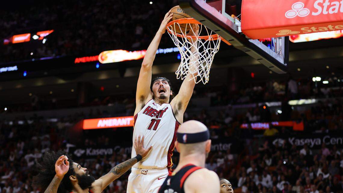 Miami Heat guard Jaime Jaquez Jr. (11) dunks the basketball against the Chicago Bulls in the fourth quarter during a play-in game of the 2024 NBA playoffs at Kaseya Center.