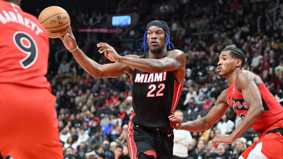 Miami Heat forward Jimmy Butler (22) passes the ball against the Toronto Raptors in the first half at Scotiabank Arena.