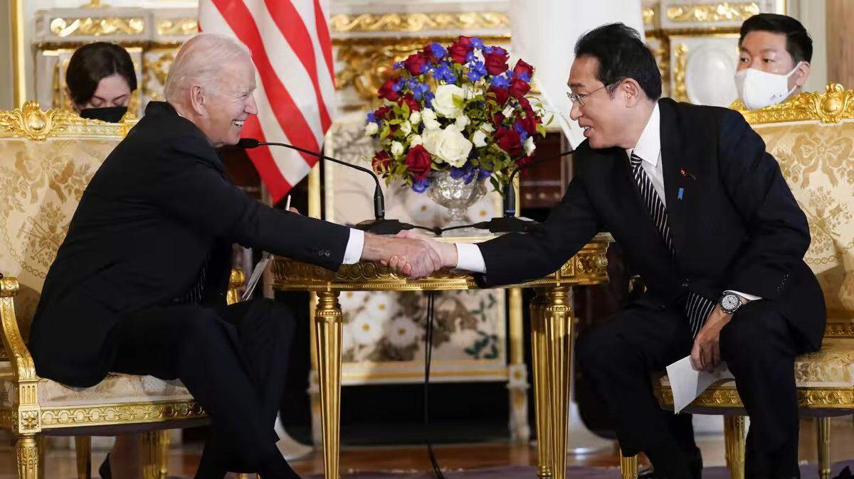President Joe Biden, left, shakes hands with Japanese Prime Minister Fumio Kishida during a meeting at the Akasaka Palace state guest house in Tokyo on May 23.