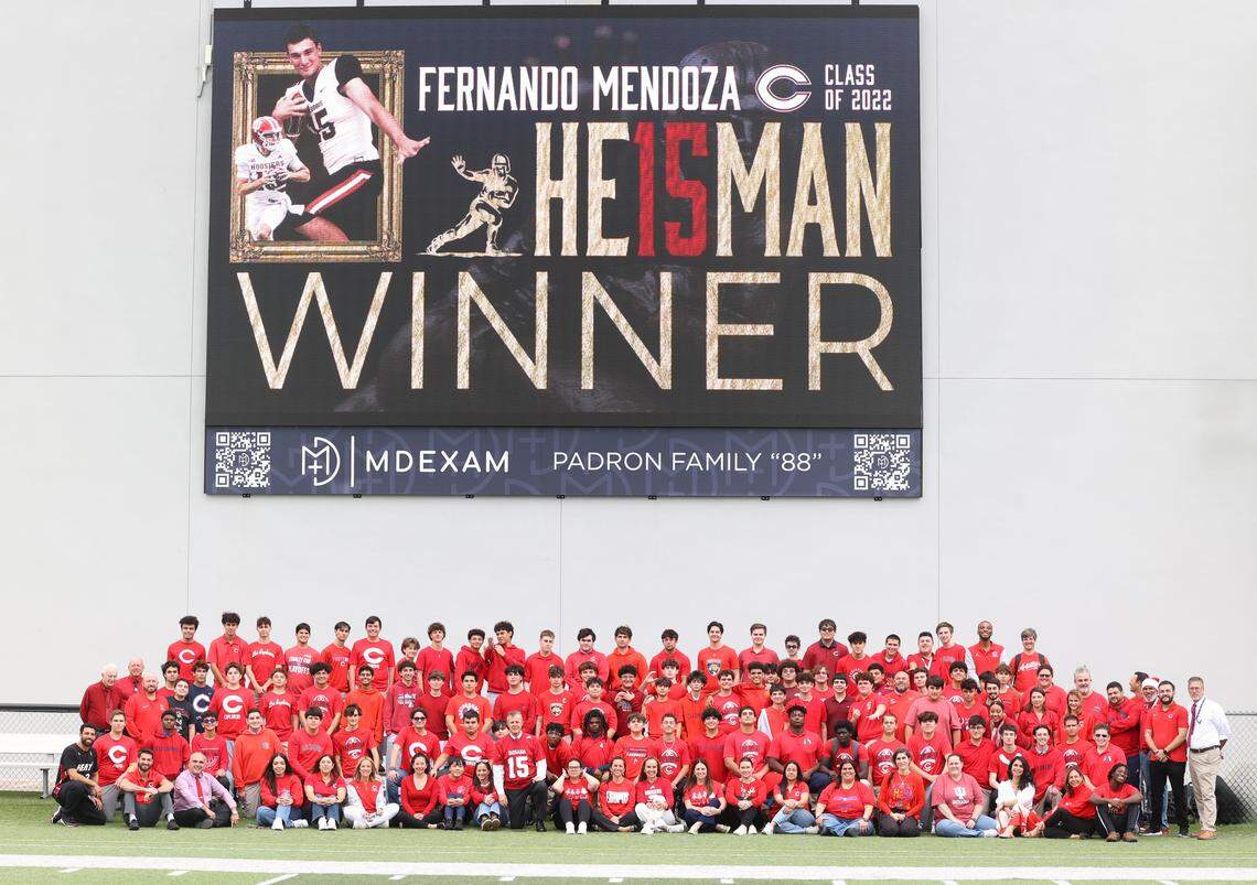Columbus students and faculty gathered for a photo recently in front of the school’s scoreboard with a message honoring alum Fernando Mendoza Jr. after he won the 2025 Heisman Trophy.