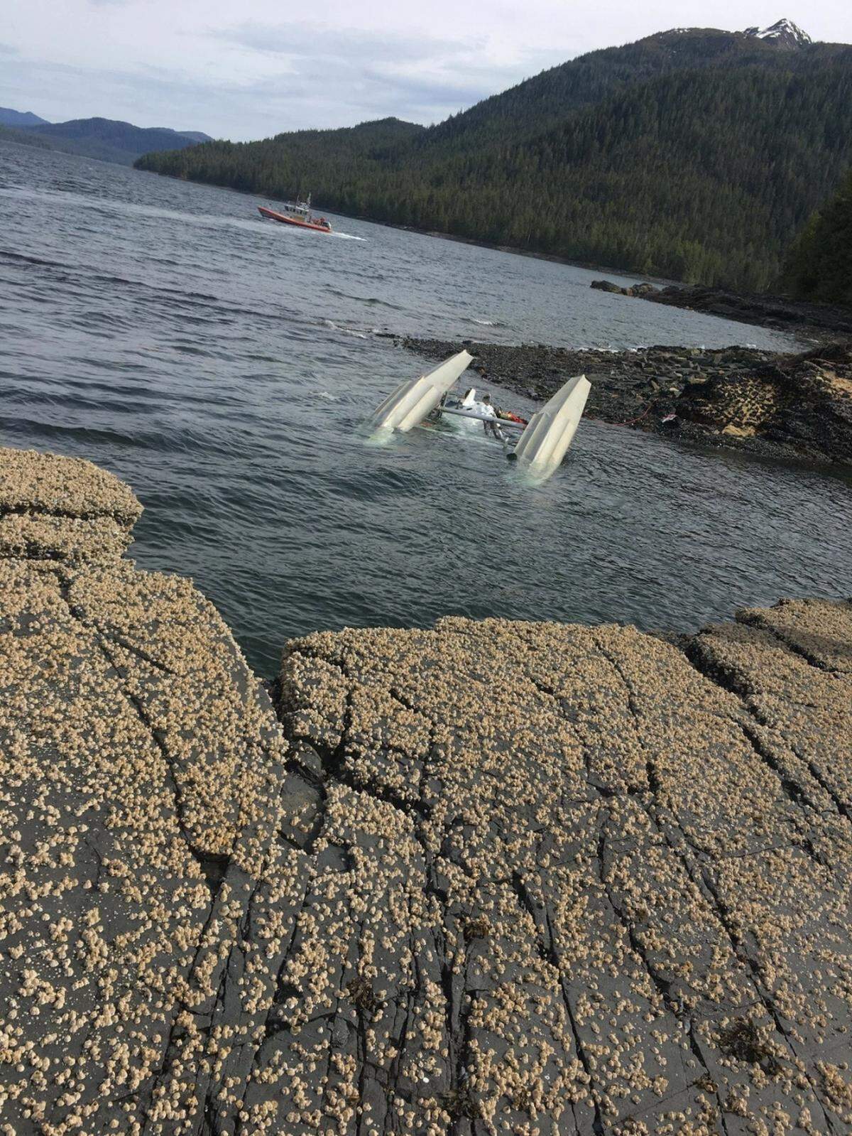 A Coast Guard Station Ketchikan crew searches for survivors from downed aircraft in the vicinity of George Inlet near Ketchikan, Alaska, May 13, 2019. The Coast Guard, Ketchikan Volunteer Rescue Squad, good Samaritans and multiple other agencies have searched extensively and continue to search for survivors from the crash.