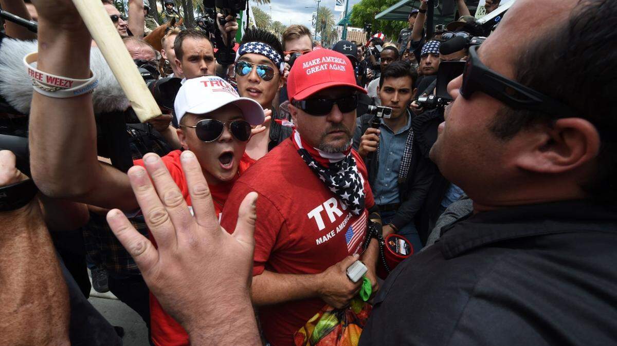 Anti-Trump protesters, right, clash with Trump supporters outside the Anaheim Convention Center in California during a rally for the then-Republican presidential candidate Donald in 2016.