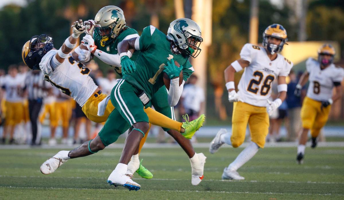 Immaculata-La Salle High School’s wide receiver Brandon Kinsey (1) carries the ball against Belen Jesuit in the first half at Tropical Park Stadium in Miami, Florida, on Friday, September 6, 2024.