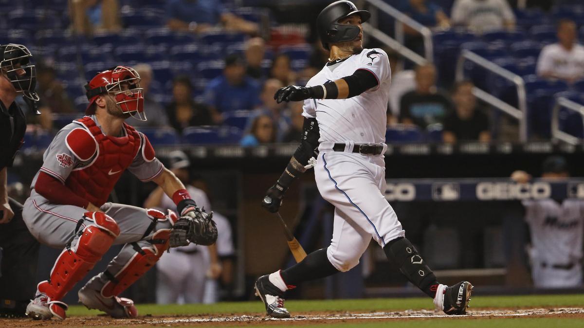 Miami Marlins second baseman Isan Diaz (1) hits a two-run double during the first inning of a Major League Baseball game against the Cincinnati Reds at Marlins Park in Miami on Tuesday, August 27, 2019.