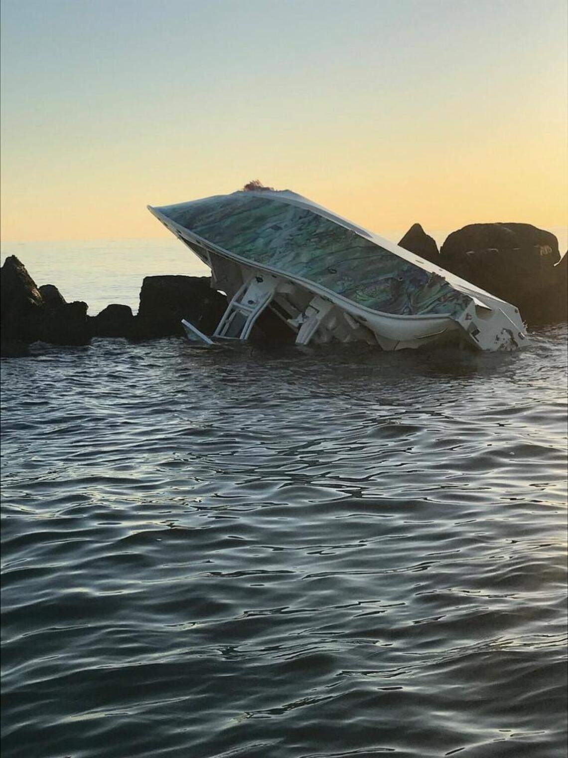 A Lighthouse Point couple is dead after a Saturday night boating crash that flipped this boat on Government Cut’s north jetty, Florida Fish & Wildlife Conservation Commission said.