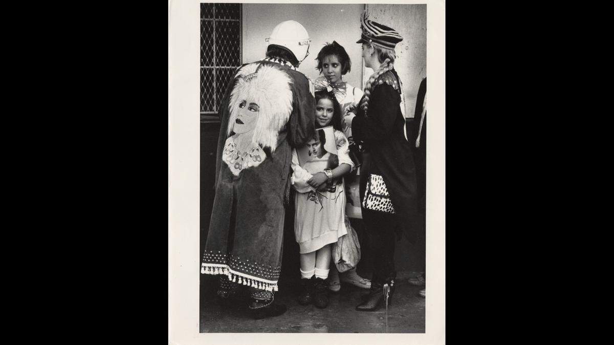 In this file photo from May 27, 1987, Chantal Noelle, then-8, in the center holding the Madonna photo, waits outside the Orange Bowl with sister Michelle Noelle, then-12, and parents Zanielo and Thamer (right). Madonna was performing her Who’s That Girl Tour from the former Miami sports stadium.