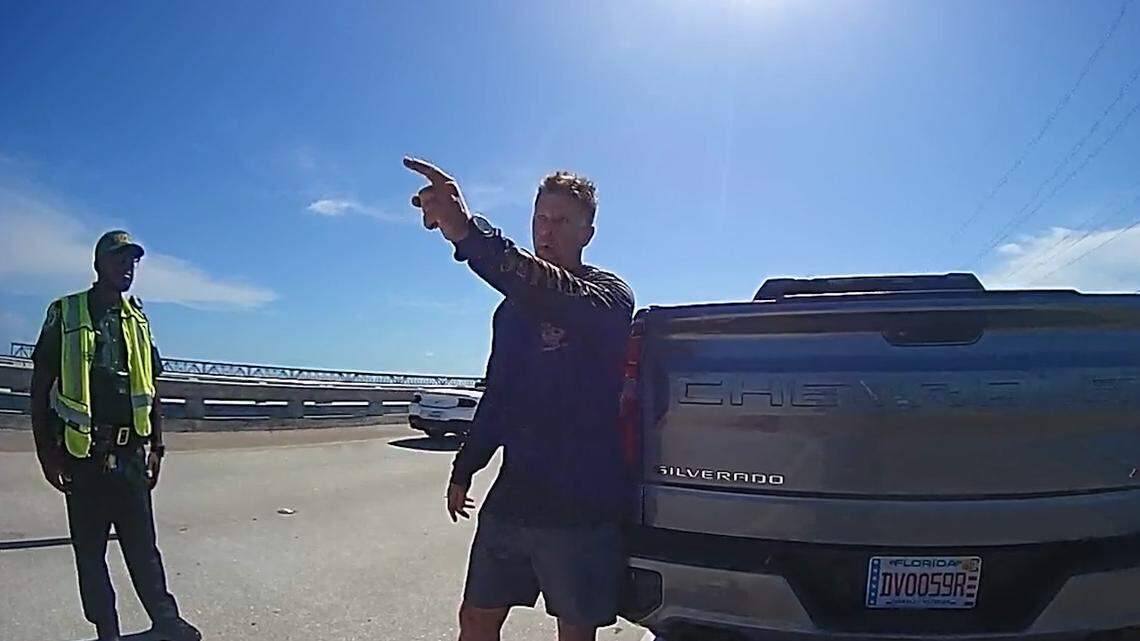 U.S. Immigration and Customs Enforcement Agent Scott Deiseroth speaks with Monroe County Sheriff’s Office deputies during a driving under the influence stop on the Bahia Honda Bridge Wednesday, Aug. 13, 2025. During the traffic stop, Deiseroth questioned the U.S. citizenship of one of the deputies involved in his arrest, asking whether he was Haitian. 