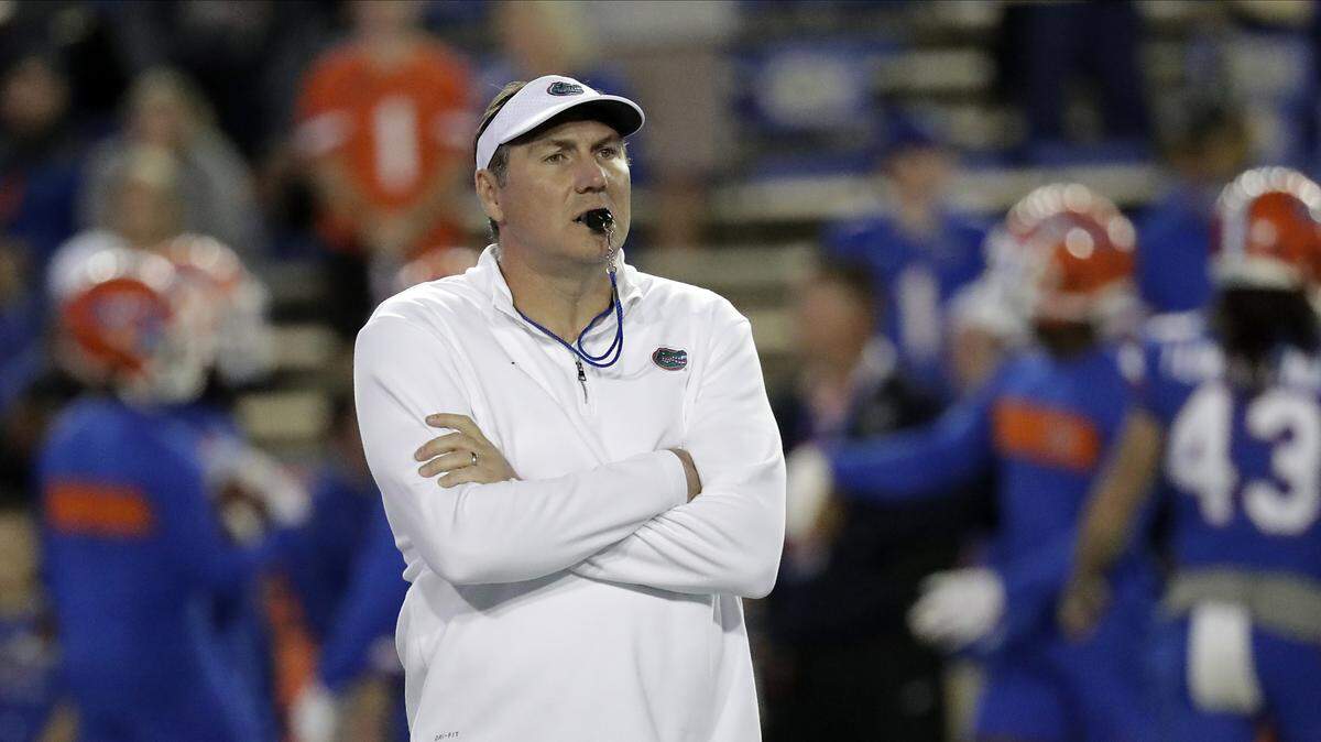 Florida head coach Dan Mullen watches his players warm up before an NCAA college football game against Florida State, Saturday, Nov. 30, 2019, in Gainesville, Fla.