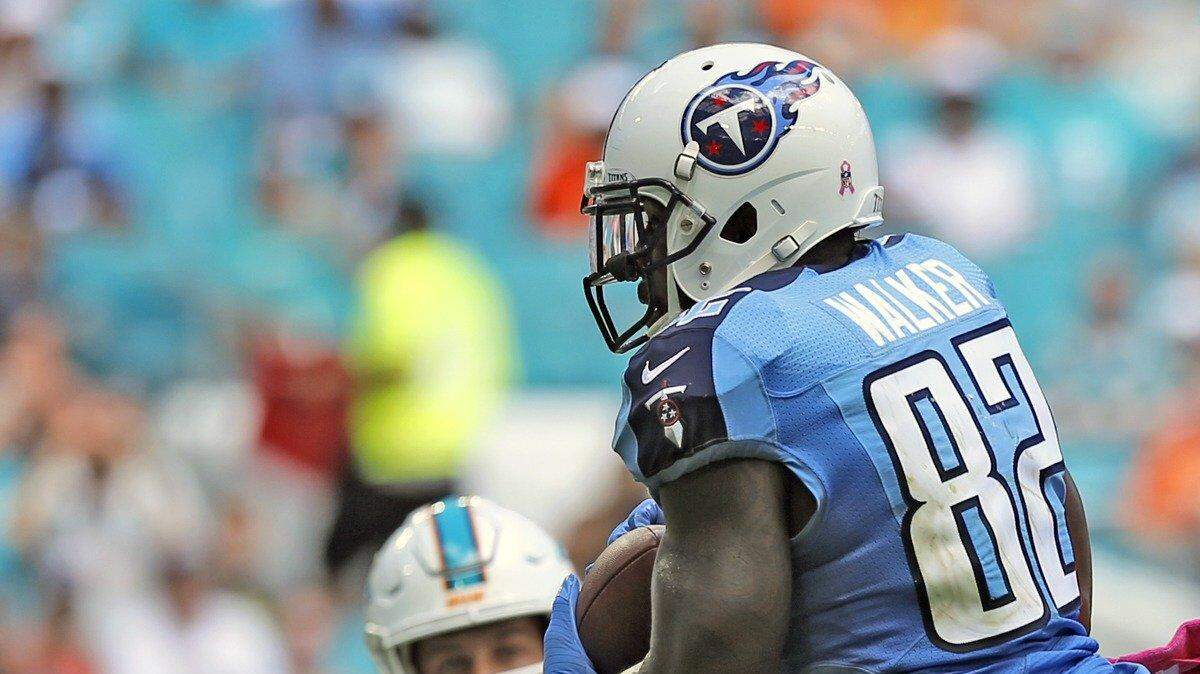Tennessee Titans tight end Delanie Walker (82) scores over Miami Dolphins free safety Michael Thomas (31) in the second quarter as the Miami Dolphins host the Tennessee Titans at Hard Rock Stadium on Sunday, October 9, 2016.