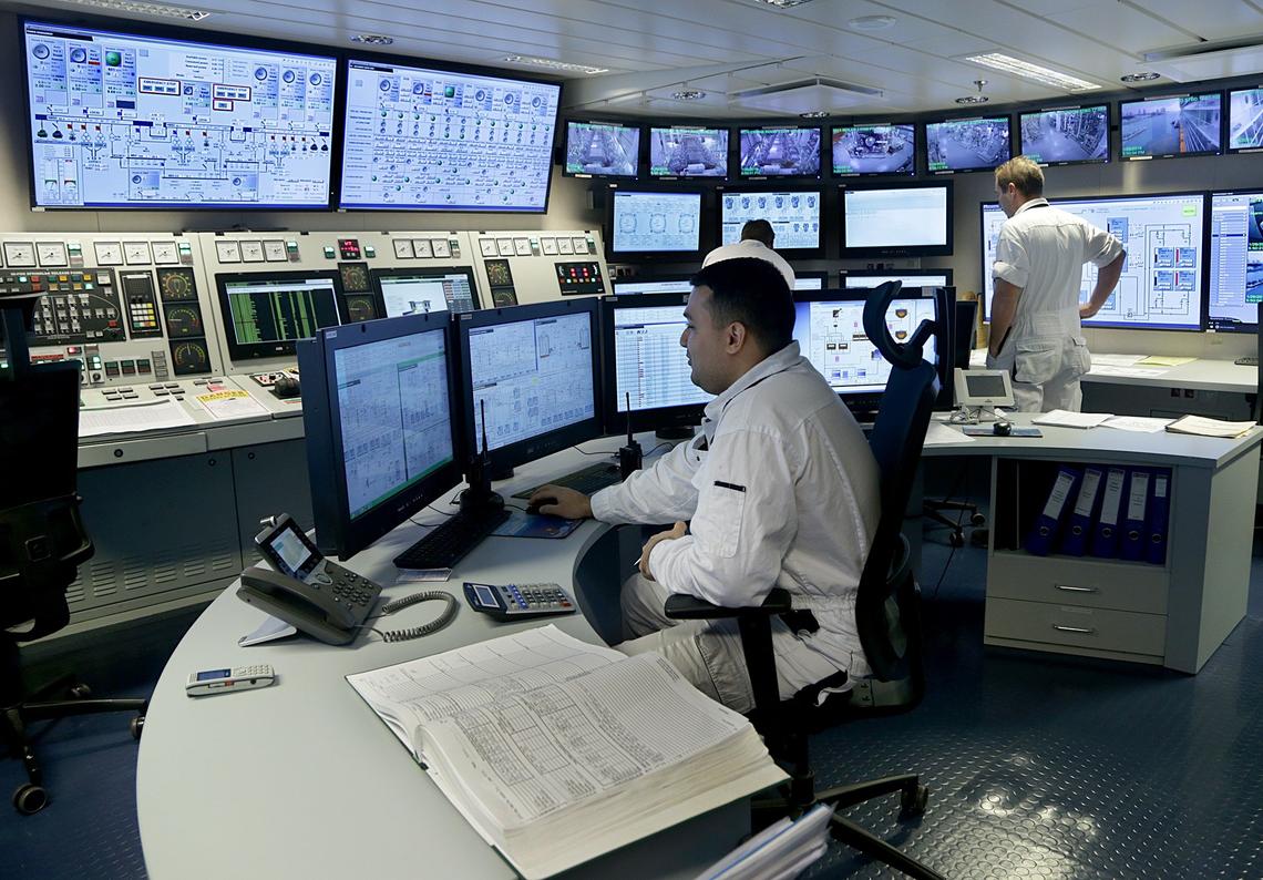 Royal Caribbean second engineer Antonio Delgado monitors the fuel and scrubber systems in the engine control room of the Symphony Of The Seas ship on Saturday, January 26, 2019. Royal Caribbean is getting ready to comply with a new sulfur cap on emissions that starts in 2020.