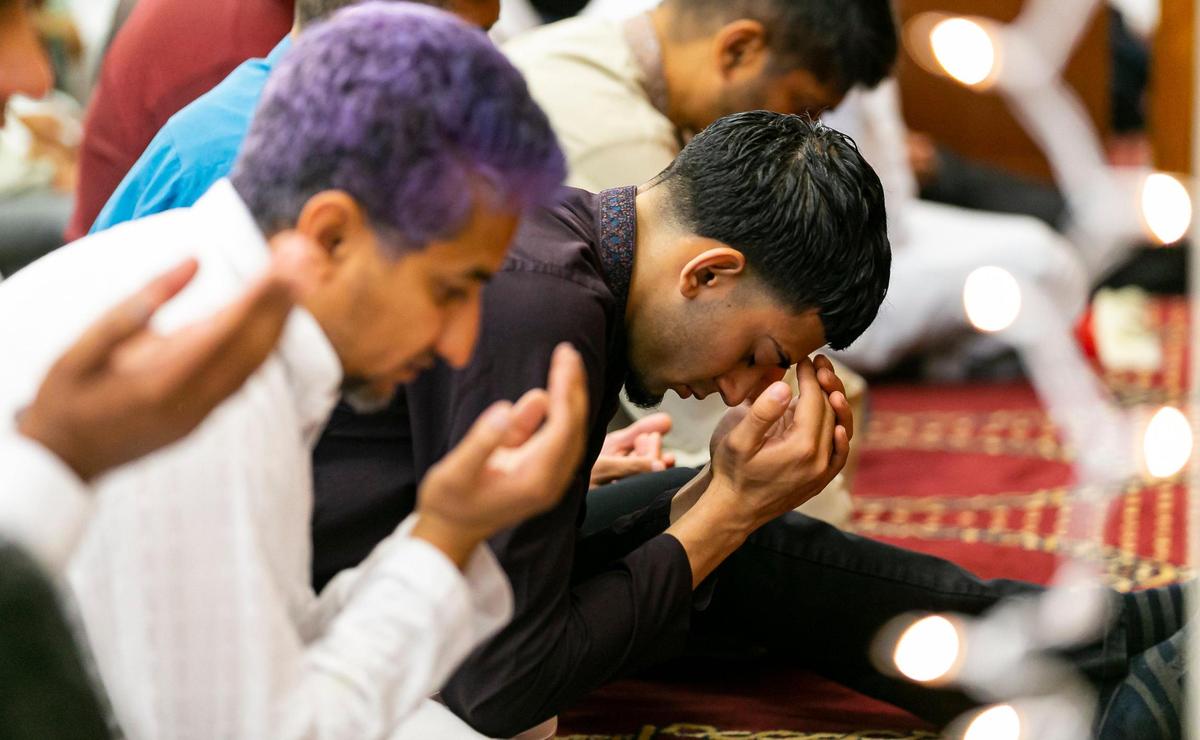 People perform the Eid al-Adha prayer at the Islamic Center of Greater Miami on Saturday, July 9, 2022, in Miami Gardens, Fla.