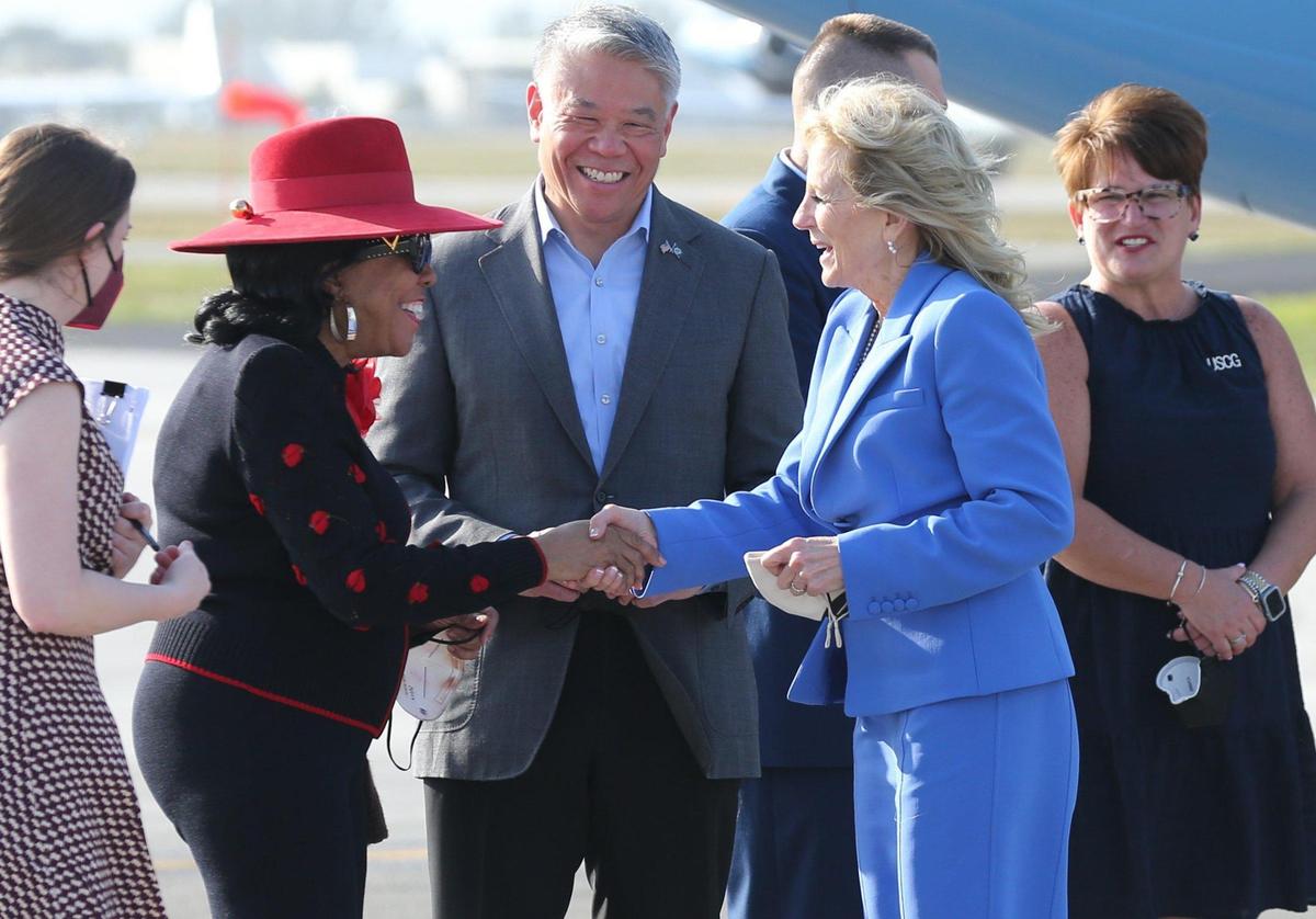 U.S. Rep. Frederica Wilson and Deputy Secretary of the Department of Homeland Security John K. Tien greet first lady Jill Biden as she arrives at U.S. Coast Guard Air Station Miami in Opa-locka for a private listening session with military families. The book reading event in partnership with Disney and Blue Star Families is an effort to bring ‘Blue Star Books’ to military families, as part of the White House’s Joining Forces initiative, on Friday, Feb. 18, 2022.