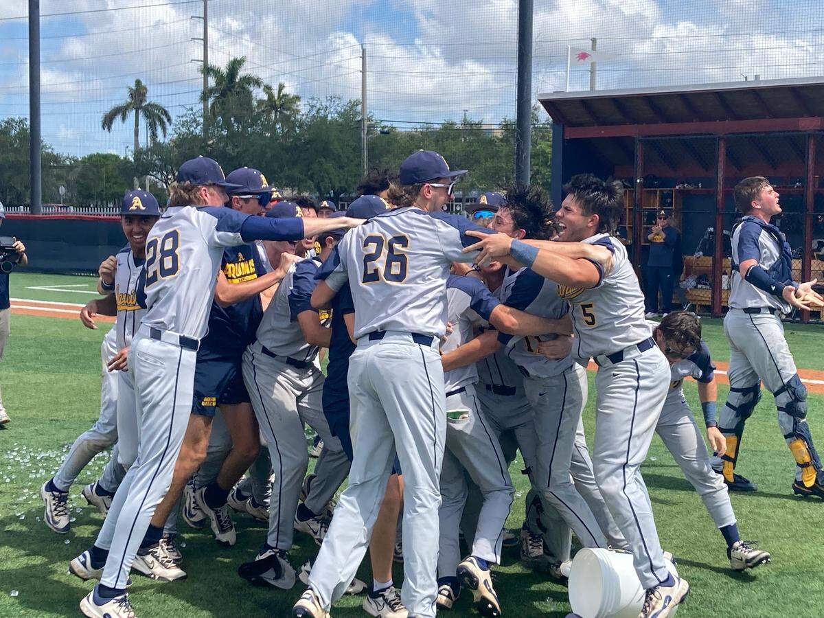 St. Thomas Aquinas players celebrate on the mound after beating Doral Academy on Saturday to clinch a berth in the Class 6A state final four in Fort Myers next week.
