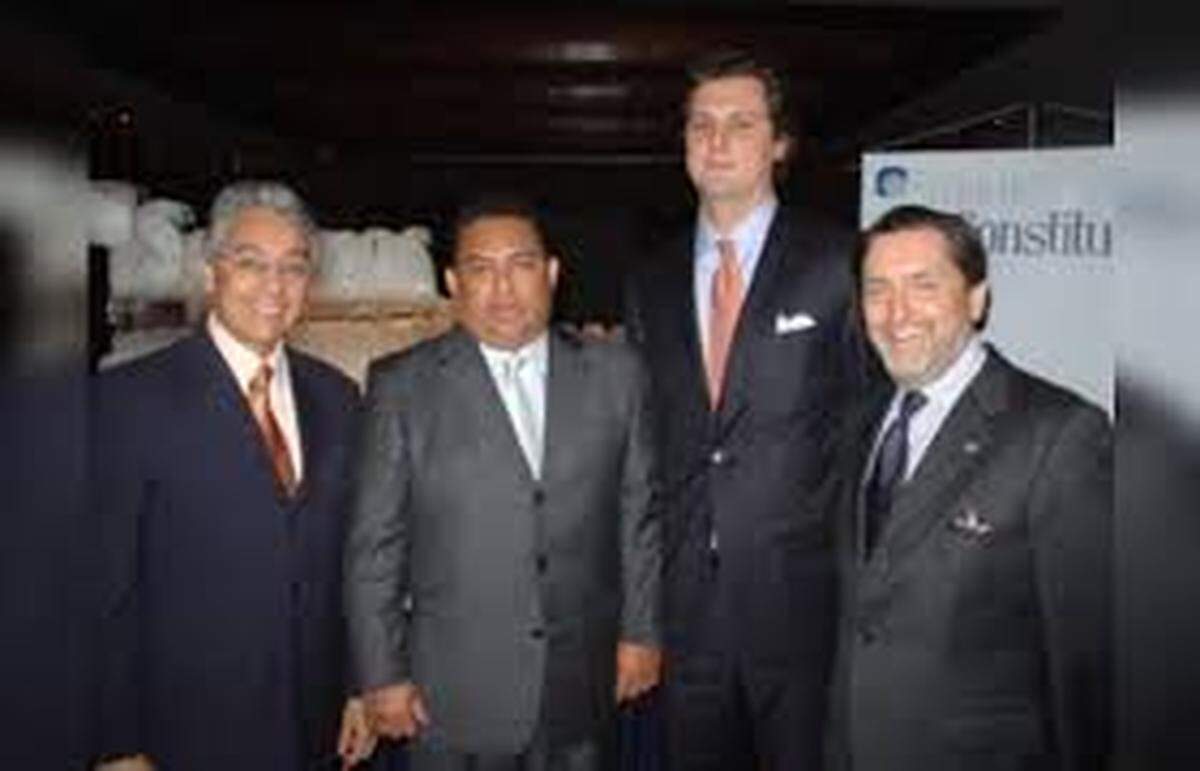 Justice Department officials told the Miami Herald they are building a case against bankers Luis Oberto Anselmi, second front right and his brother, Ignacio, far right.