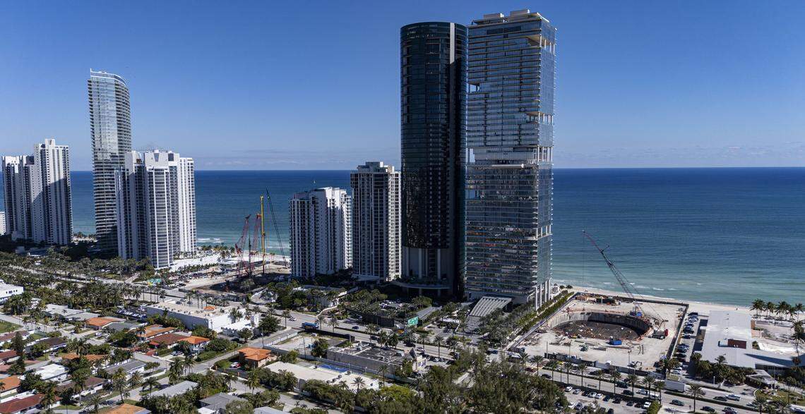 An aerial view of the Bentley, right, and the St. Regis, left, construction sites near the coastline on Friday, Oct. 31, 2025, in Sunny Isles Beach, Fla.