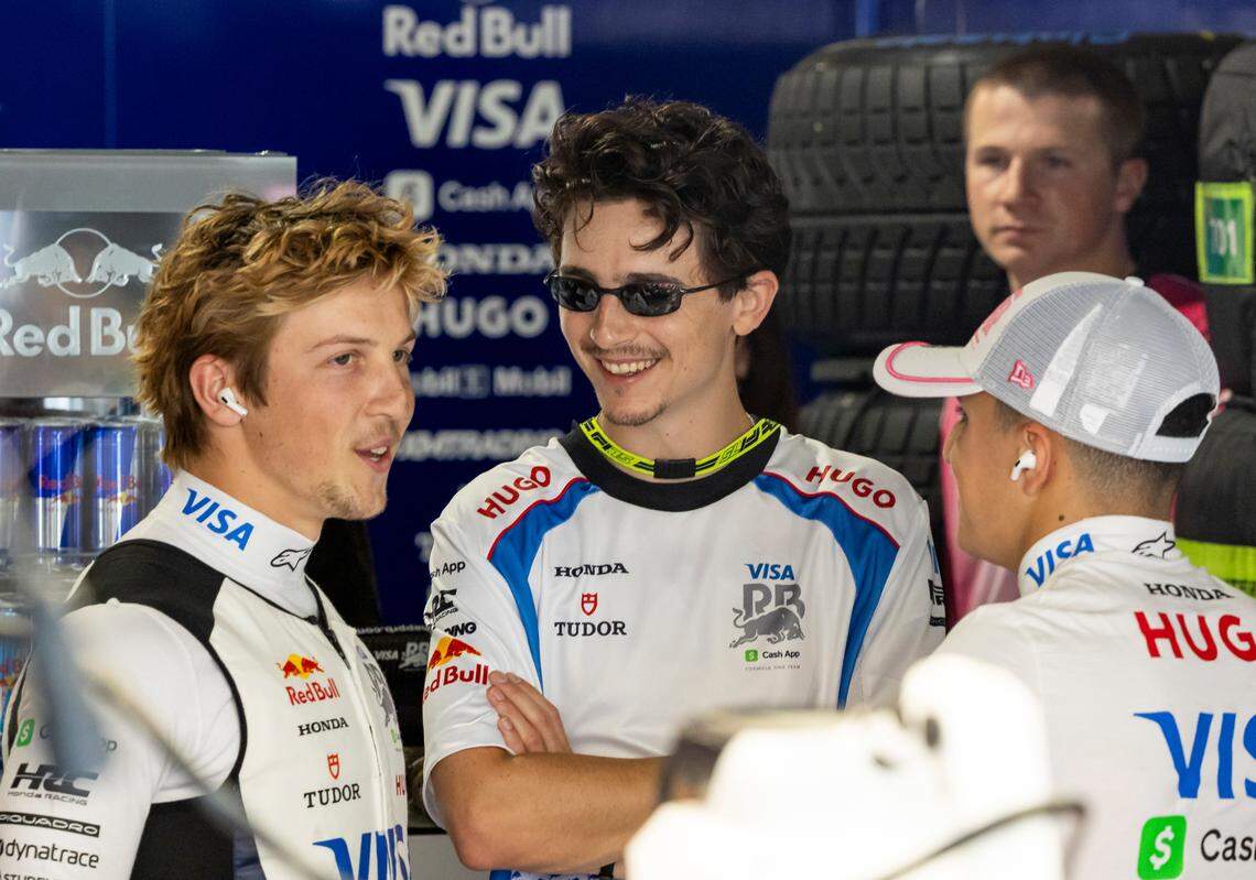 American-French actor Timothee Chalamet talks with RB drivers Liam Lawson of New Zealand and Isack Hadjar of France in their garage before the start of the Formula One Miami Grand Prix at the Miami International Autodrome on Sunday, May 4, 2025, in Miami Gardens, Fla.