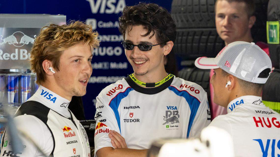 American-French actor Timothee Chalamet talks with RB drivers Liam Lawson of New Zealand and Isack Hadjar of France in their garage before the start of the Formula One Miami Grand Prix at the Miami International Autodrome on Sunday, May 4, 2025, in Miami Gardens, Fla.
