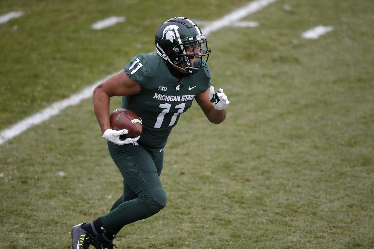 Michigan State’s Connor Heyward runs against Ohio State during an NCAA college football game, Saturday, Dec. 5, 2020, in East Lansing, Mich. Ohio State won 52-12. (AP Photo/Al Goldis)