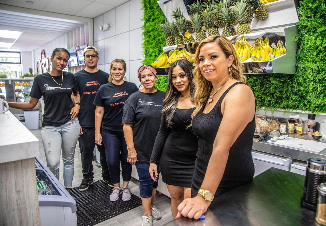 Owner Neri Santiago, far right, posed with the staff of the Juicy Juice Bar, which she opened in Hollywood.
