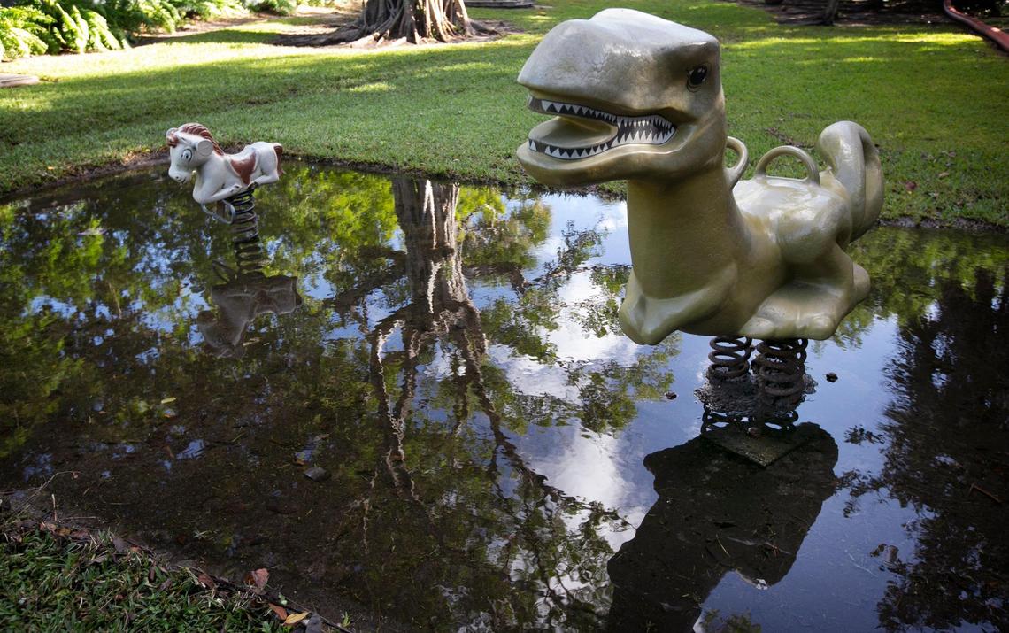 No children were playing on the dinosaur or pony ride at the Little River Pocket Mini Park on Nov. 9, 2021, after the park was flooded with king tide waters. The park and neighboring streets were both under water and City of Miami Resilience & Public Works employees were on hand pumping the water off the roads and the park and into the nearby Little River.