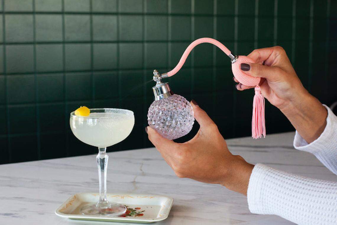 Some specialty cocktails are spritzed with an old-fashioned perfume bottle at Café Kush.