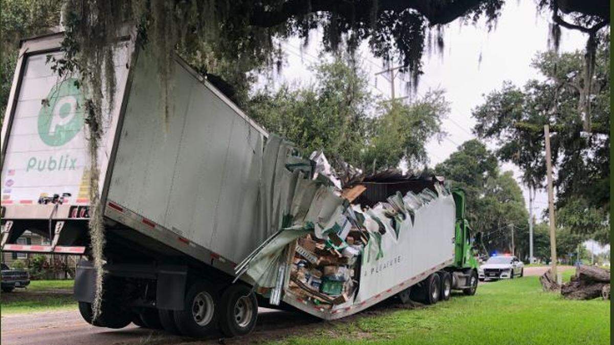 A tree met a Publix truck halfway (down the trailer).