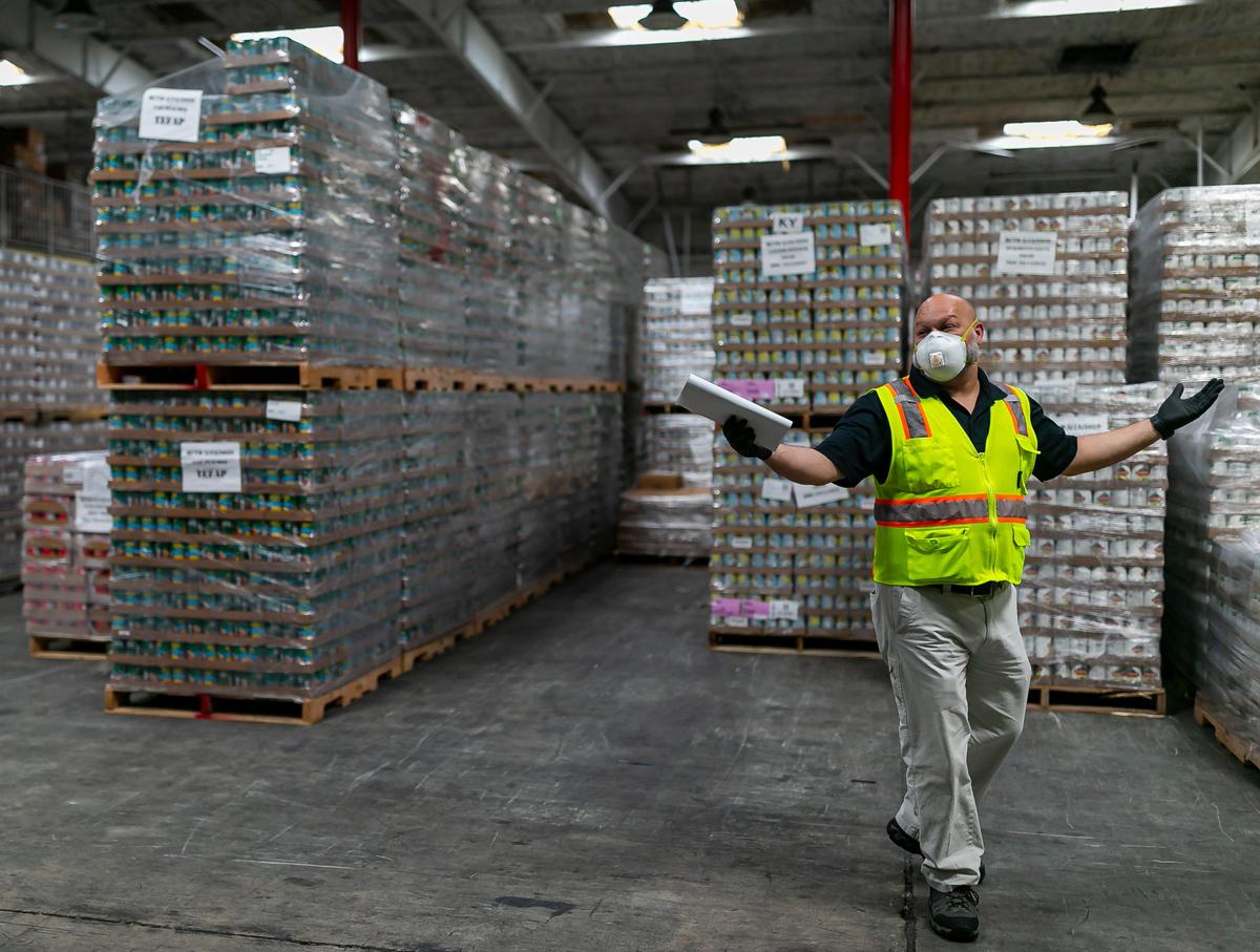 John Delgado, 52, the assistant operations manager at Farm Share, spends his days getting donated food to distribution centers where it is donated to people who need it.