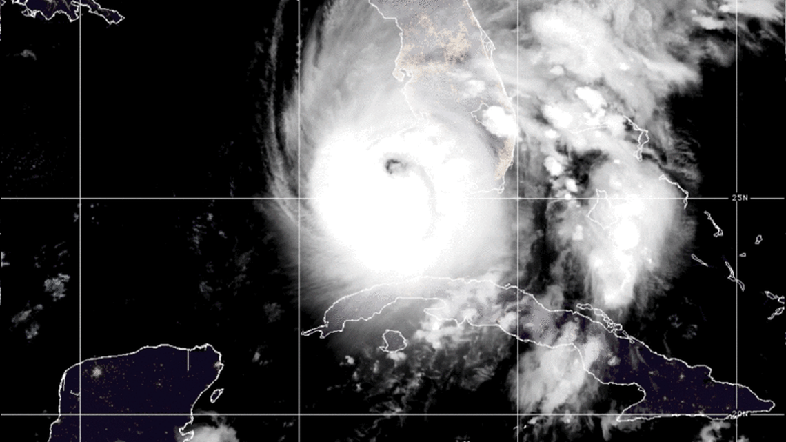 A satellite photo from the National Oceanic and Atmospheric Administration at 4 a.m. Wednesday shows most of Cuba in darkness, after the country’s entire electrical grid failed in the aftermath of Hurricane Ian. For comparison, Florida cities are brightly lit under the storm’s cloud cover.