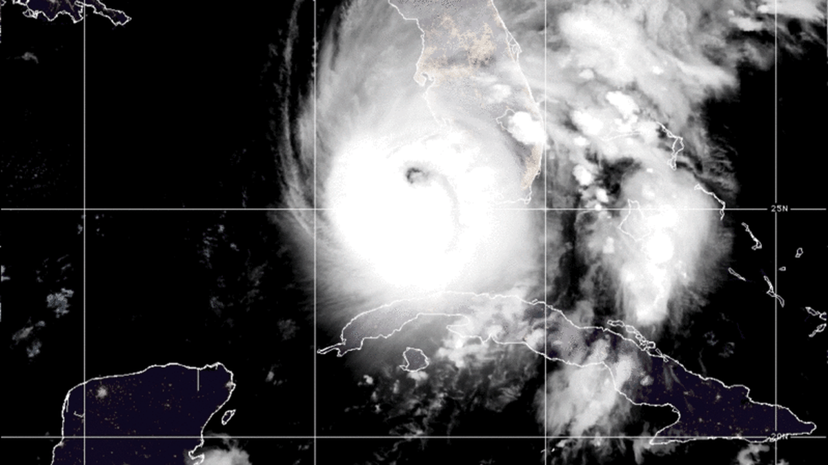 A satellite photo from the National Oceanic and Atmospheric Administration at 4 a.m. Wednesday shows most of Cuba in darkness, after the country’s entire electrical grid failed in the aftermath of Hurricane Ian. For comparison, Florida cities are brightly lit under the storm’s cloud cover.