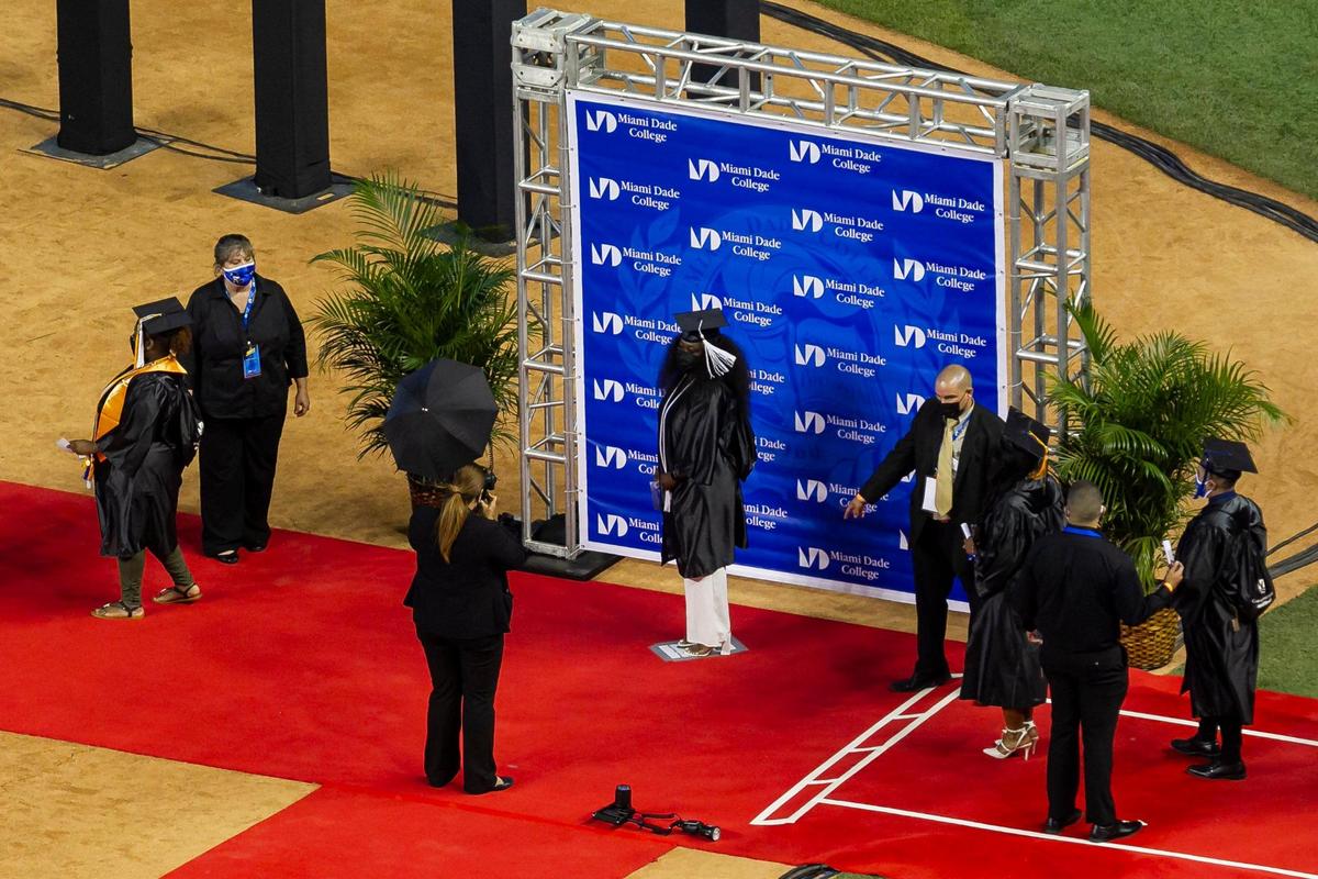 Miami Dade College students are photographed during their graduation ceremony inside loanDepot park in Miami, Florida on Saturday, May 1, 2021.