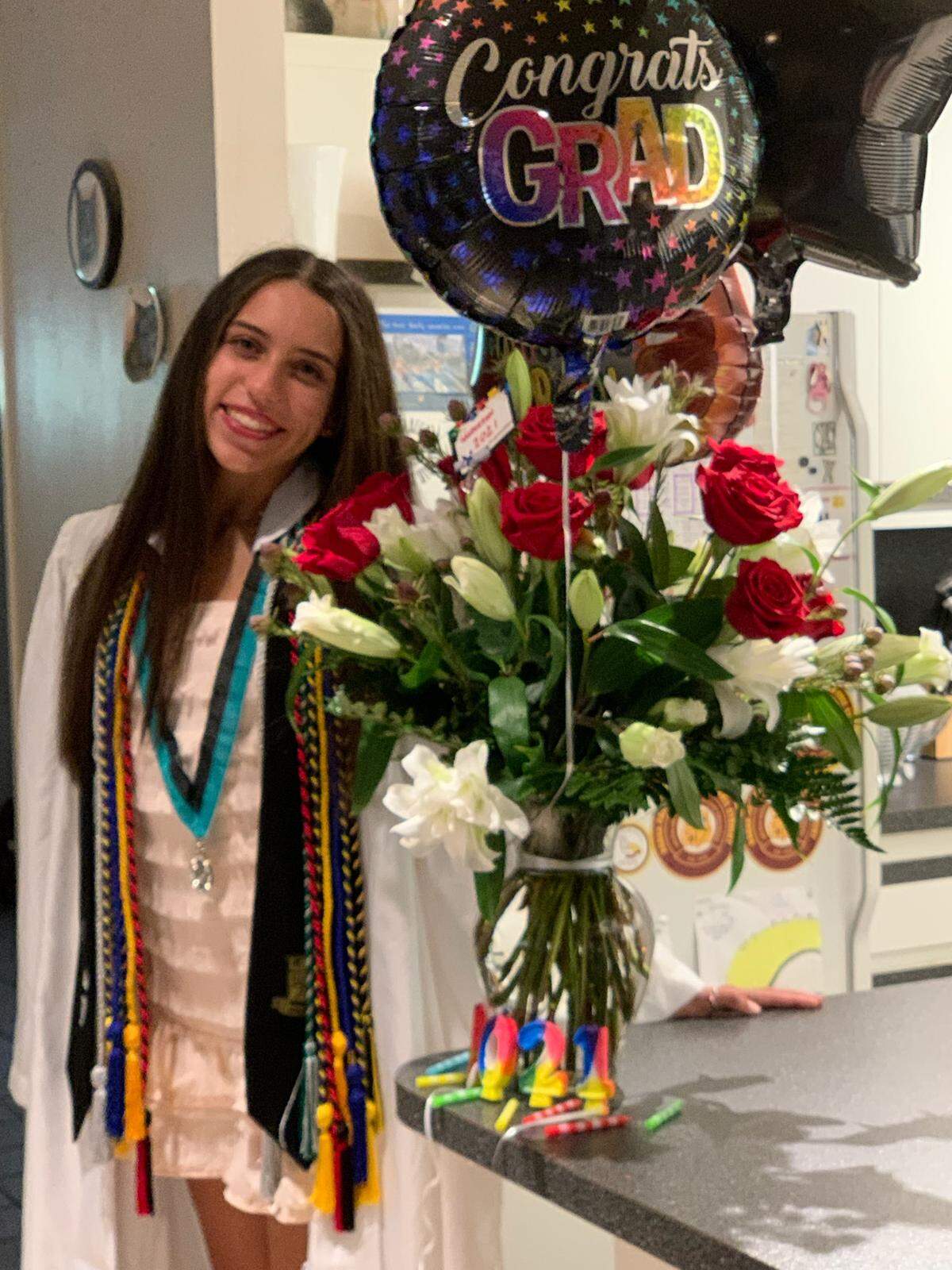 Jade Sharon graduated from Coral Reef High School after 12 years ofperfect attendance, just like her dad. 