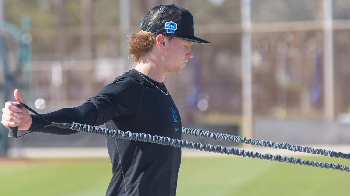Miami Marlins pitcher Max Meyer goes through arm workouts at the Roger Dean Chevrolet Stadium complex in Jupiter, Florida, on Feb. 13, 2023.