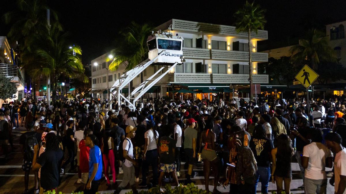 Crowds gather at Ocean Drive and 8th Street during spring break in Miami Beach, Florida, on Saturday, March 18, 2023.